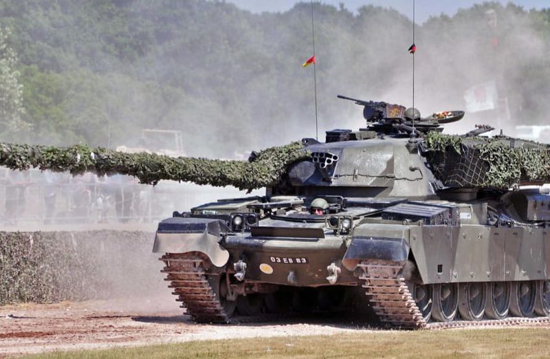   'Driving the 56t tank in Germany.  Zoom in to see the heads.  That's mine at the top.'