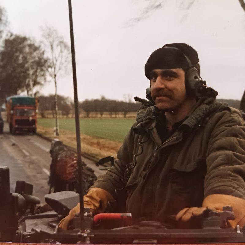 'On exercise in Germany.  The Colonel's Tank Commander, about to make tea on the boiling vessel inside the tank.'